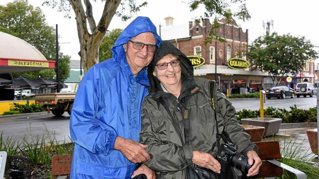 Graeme and Loretta Clothier enjoy the wet weather in Roma. Picture: Alexia Austin