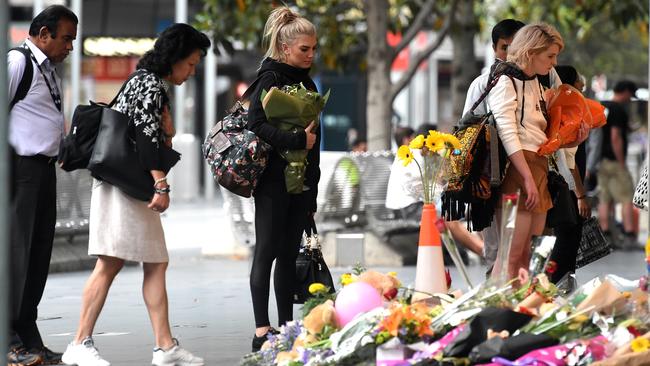 People lay flowers this morning. Picture: Nicole Garmston