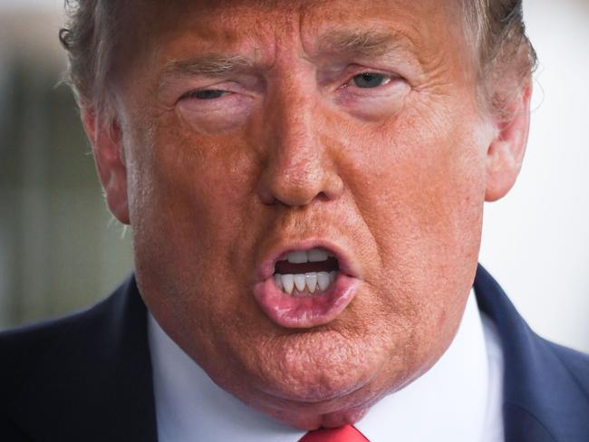 (FILES) In this file photo US President Donald Trump speaks to the press before departing the White House  on June 20, 2020 in Washington, DC, for a campaign rally in Tulsa, Oklahoma. - One of Donald Trump's brothers requested a restraining order to block publication of a potentially explosive book written by the US president's niece, The New York Times reported June 23, 2020. Mary Trump will release her no-holds-barred memoir "Too Much and Never Enough: How My Family Created the World's Most Dangerous Man," on July 28, according to publishing house Simon & Schuster. (Photo by Eric BARADAT / AFP)