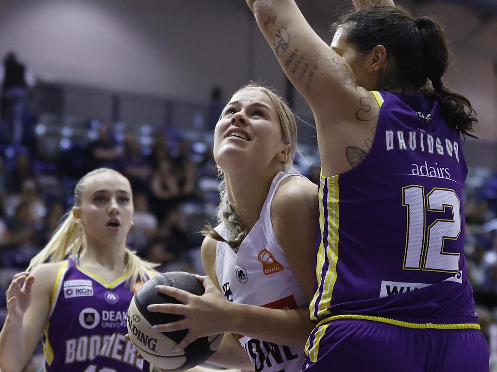 Isla Juffermans of the Flames shoots under pressure from Penina Davidson of the Boomers during the WNBL match between Melbourne Boomers and Sydney Flames. Picture: Daniel Pockett/Getty Images