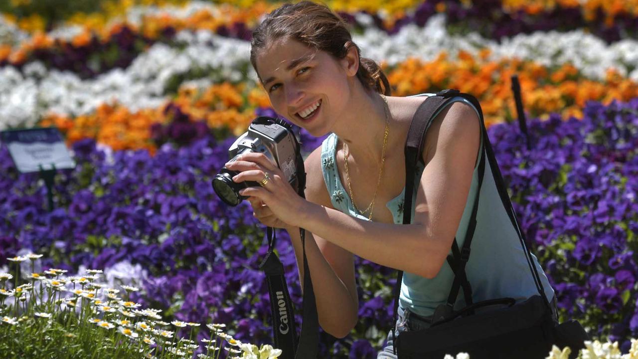 Keen photographer Mariana Jeffers 25yr Kuraby – Brisbane captivated by the colour at Queens Park, Toowoomba. Picture: David Martinelli.