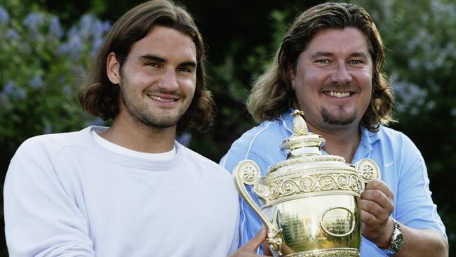 LONDON - JULY 6: Men's Singles champion Roger Federer of Switzerland poses with the trophy with his coach Peter Lundgren during the final day of the Wimbledon Lawn Tennis Championships held on July 6, 2003 at the All England Lawn Tennis and Croquet Club, in Wimbledon, London. (Photo by Phil Cole/Getty Images)