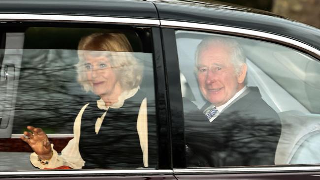 King Charles III and Britain's Queen Camilla wave as they leave by car from Clarence House in London on February 6, 2024. The Queen is reportedly “exhausted” from filling in for the King. Picture: AFP