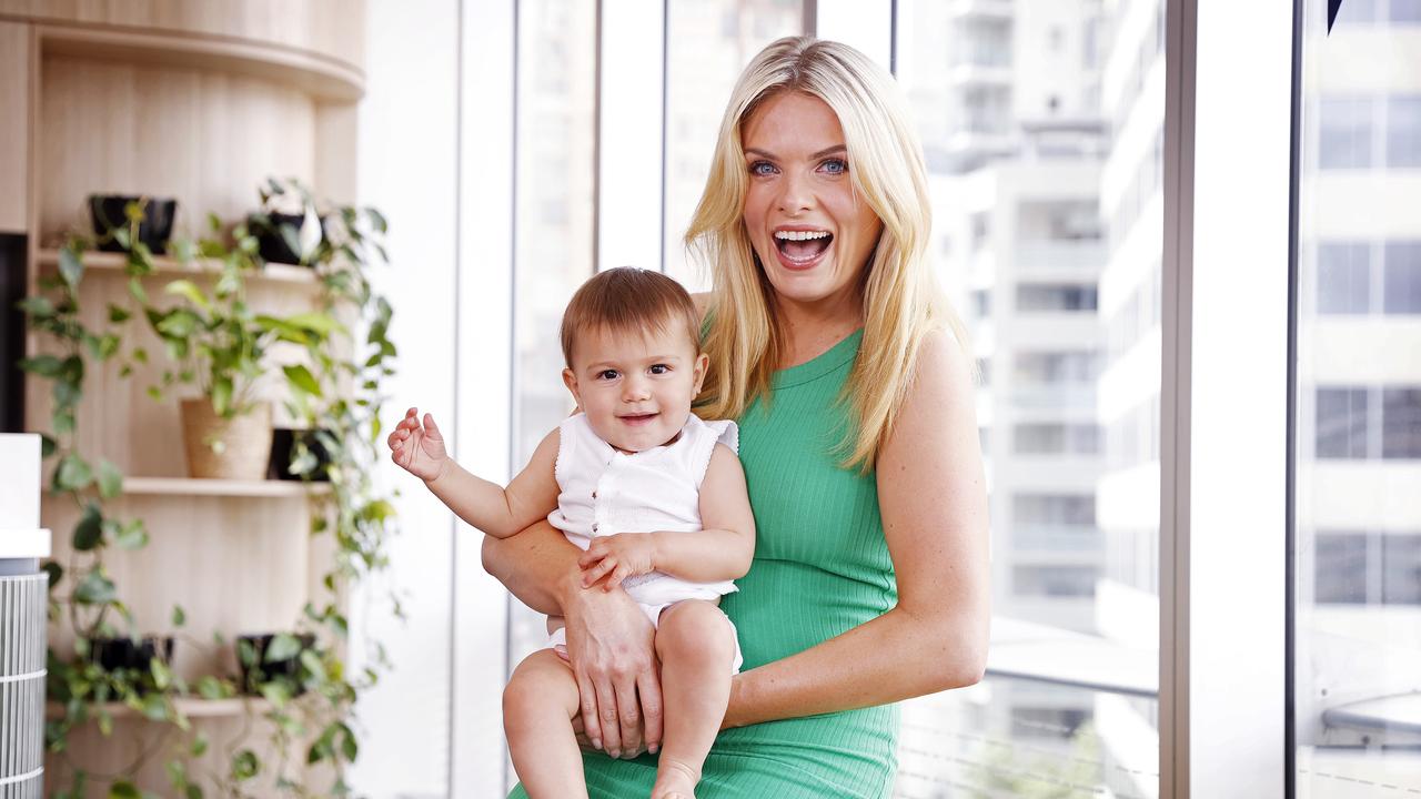 Erin Molan pictured with Sibella Diaz, 10 months, who is wearing a singlet from Erin’s baby clothes range. Picture: Sam Ruttyn