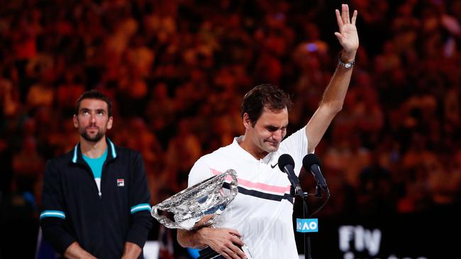 Roger Federer breaks down in tears as Marin Cilic ponders what might have been. Picture: Getty