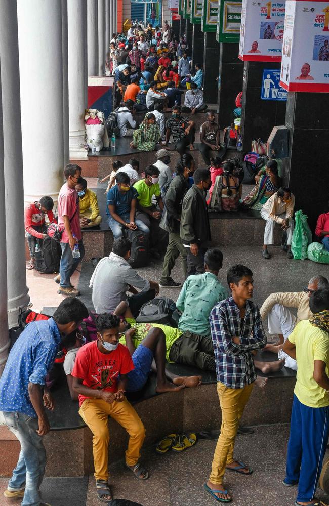 After a surge which saw India in crisis, passengers wait in crowds at a railway station in New Delhi. Picture: Prakash Singh / AFP