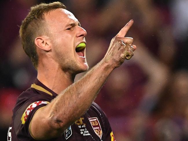 Daly Cherry-Evans of the Maroons reacts after scoring a try during Game 3 of the 2018 State of Origin series between the NSW Blues and the Queensland Maroons at Suncorp Stadium in Brisbane, Wednesday, July 11, 2018. (AAP Image/Dave Hunt) NO ARCHIVING, EDITORIAL USE ONLY