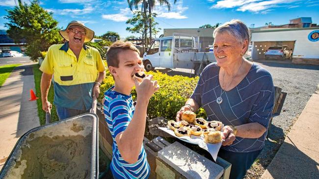 JOB DONE: Brickie Peter Moriz with his son Samuel and CWA president Irene Wells. Picture: TREVOR VEALE