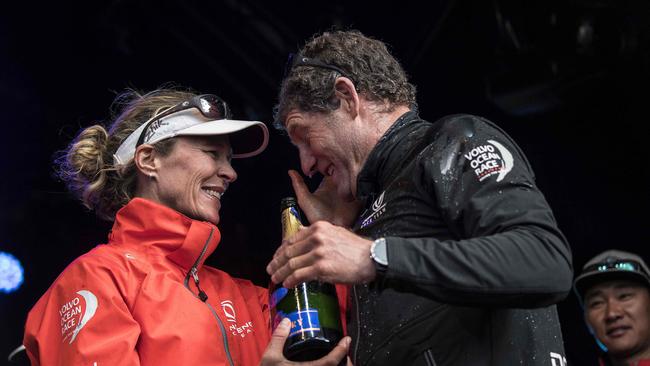 Dutch trimmer Carolijn Brouwer and French skipper Charles Caudrelier celebrate their Volvo Ocean Race win. AFP PHOTO / Christophe ARCHAMBAULT