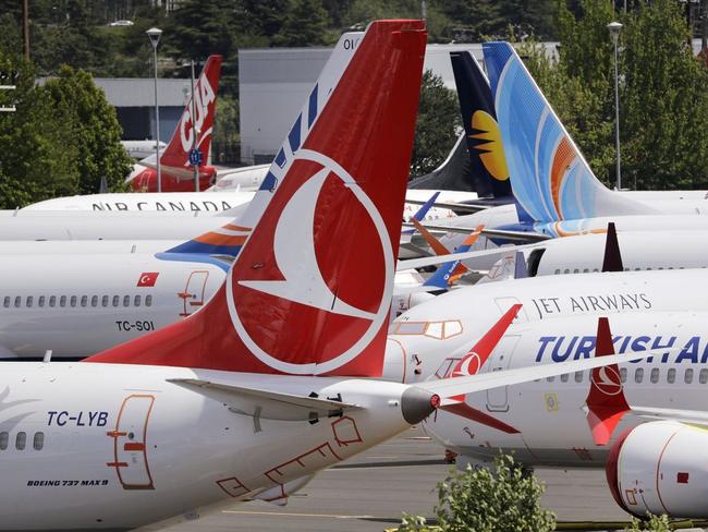 Dozens of grounded 737 MAX airplanes crowded a Boeing parking field on June 27; Boeing said deliveries of commercial jetliners fell by more than a third in the first half of 2019. PHOTO: ELAINE THOMPSON/ASSOCIATED PRESS