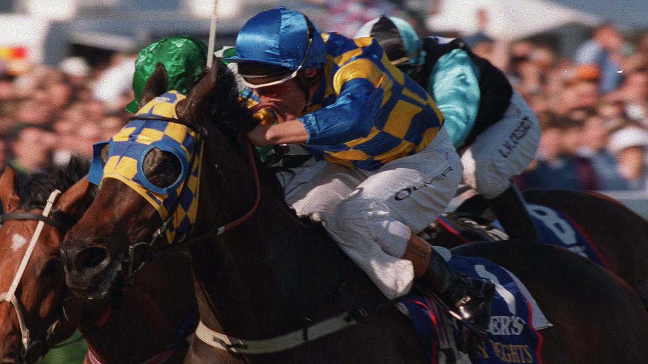 Horseracing - racehorse Sky Heights ridden by jockey Damien Oliver winning Caulfield Cup against Laebeel ridden by Stephen Baster (l) at Caulfield 16 Oct 1999. a/ct