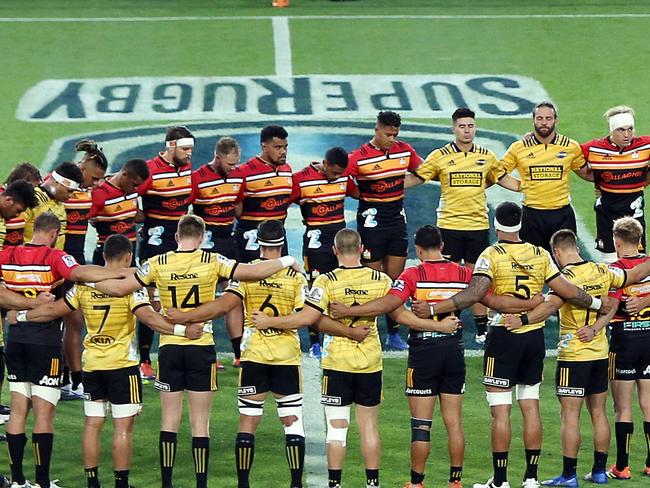 HAMILTON, NEW ZEALAND - MARCH 15: The Chiefs and Hurricanes come together for a moments silence prior to the round five Super Rugby match between the Chiefs and the Hurricanes at FMG Stadium on March 15, 2019 in Hamilton, New Zealand. (Photo by Michael Bradley/Getty Images)