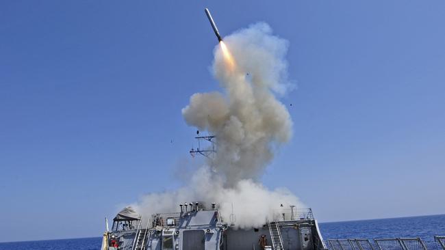 A United States guided-missile destroyer launches a Tomahawk cruise missile. picture: Jonathan Sunderman/US Navy/AFP