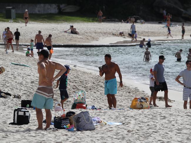 Balmoral Beach in Mosman has drawn crowds of people to the popular esplanade despite the warnings about the COVID-19 virus pandemic. Picture: David Swift