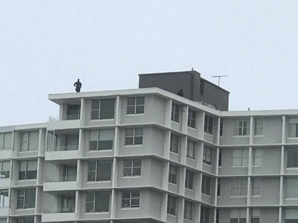 Snipers on the roof of a high-rise Bondi apartment ahead of the royals' arrival. Picture: James Weir