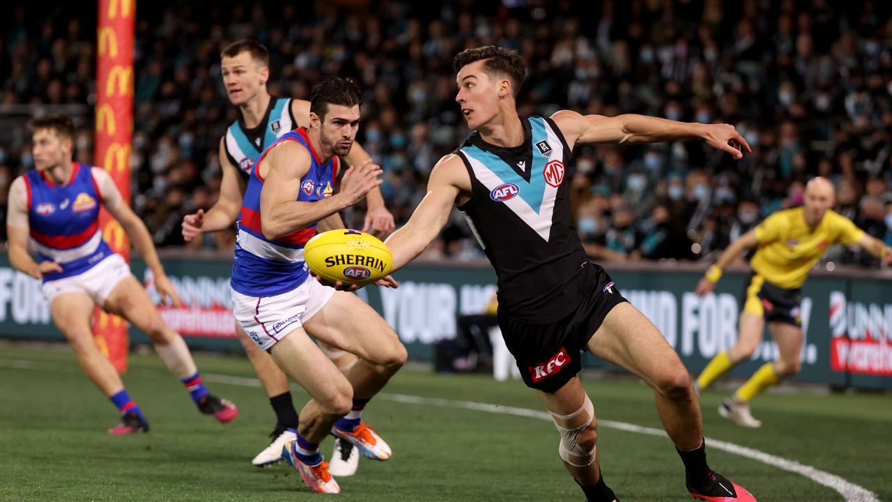 Connor Rozee breaks away from Easton Wood in the opening term. Picture: James Elsby/AFL Photos