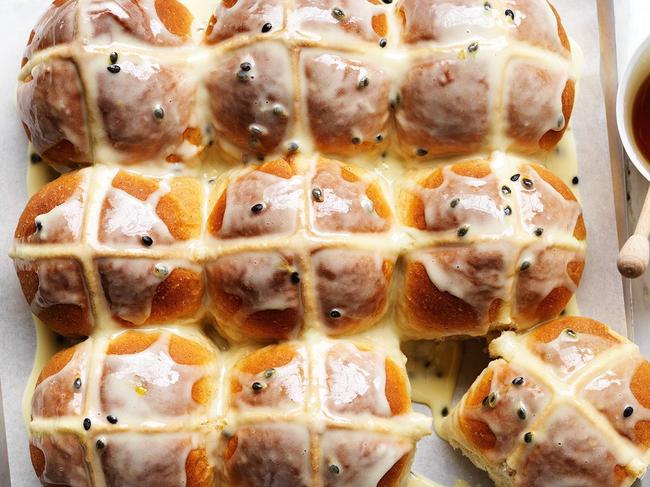 Vanilla hot cross buns with passionfruit glaze.