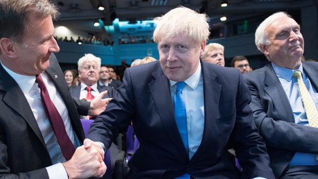 Foreign Secretary Jeremy Hunt (left) reacts as fellow leadership contender Boris Johnson is elected as the new leader of the Conservative Party and British Prime Minister. Picture: Stefan Rousseau/WPA Pool/Getty Images