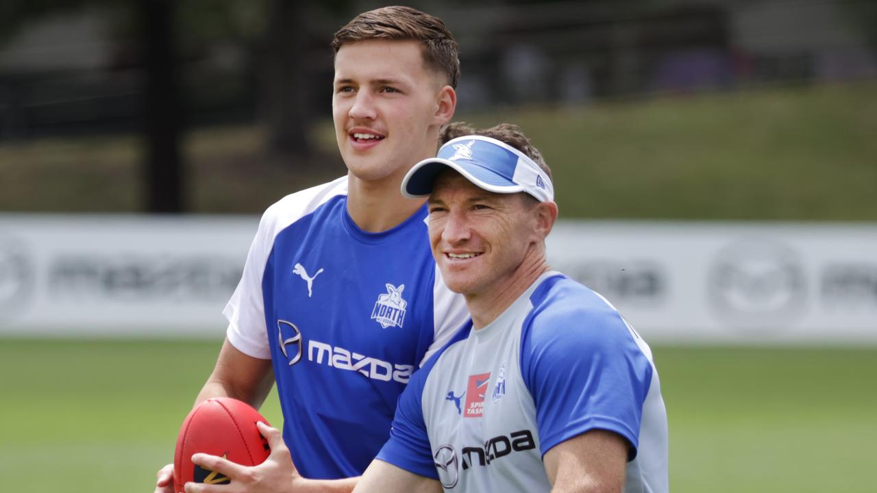 North Melbourne father-son selection Cooper Harvey and his dad, Brent Harvey at North Melbourne Football Club training. Picture: David Caird