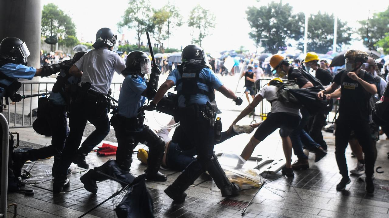 Protesters were pushed out. Picture: Anthony Wallace/AFP