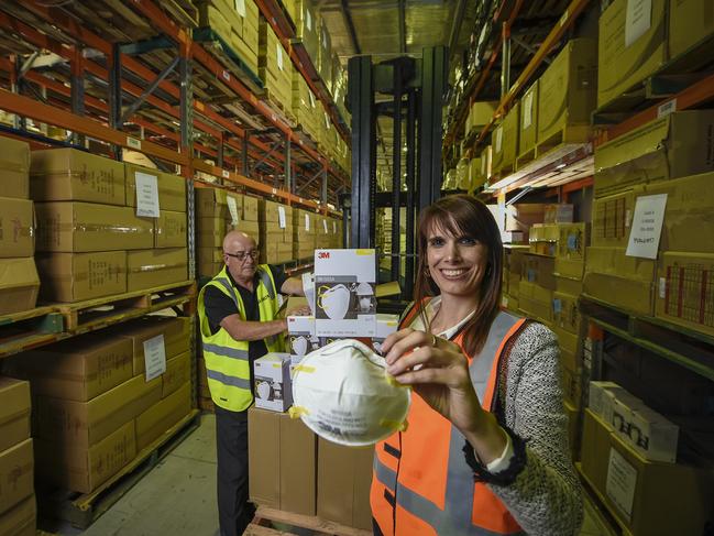 SA Health receives face masks from overseas.Lyndon Rowe and Edurne Esparza with some of the 3M masks.Tuesday April 14 2020.PIC Roy VanDerVegt