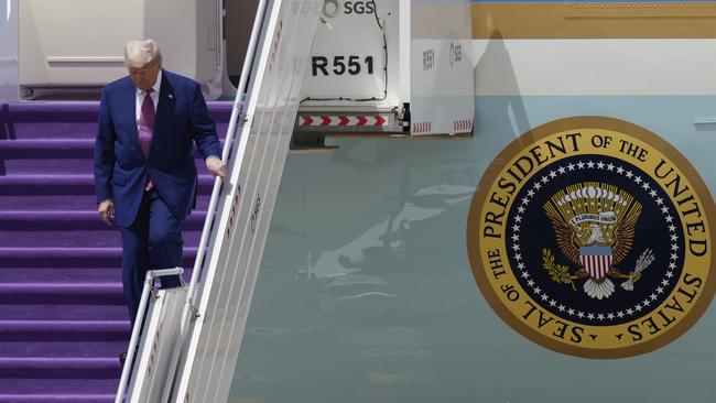Mr Trump walks down the stairs of Air Force One upon his arrival at King Khalid International Airport Royal Terminal in Riyadh, Saudi Arabia Picture: AP