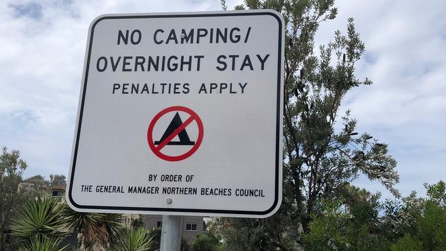 A sign prohibiting campervans and motorhomes staying overnight in the car park at Freshwater Beach. Picture: Jim O'Rourke