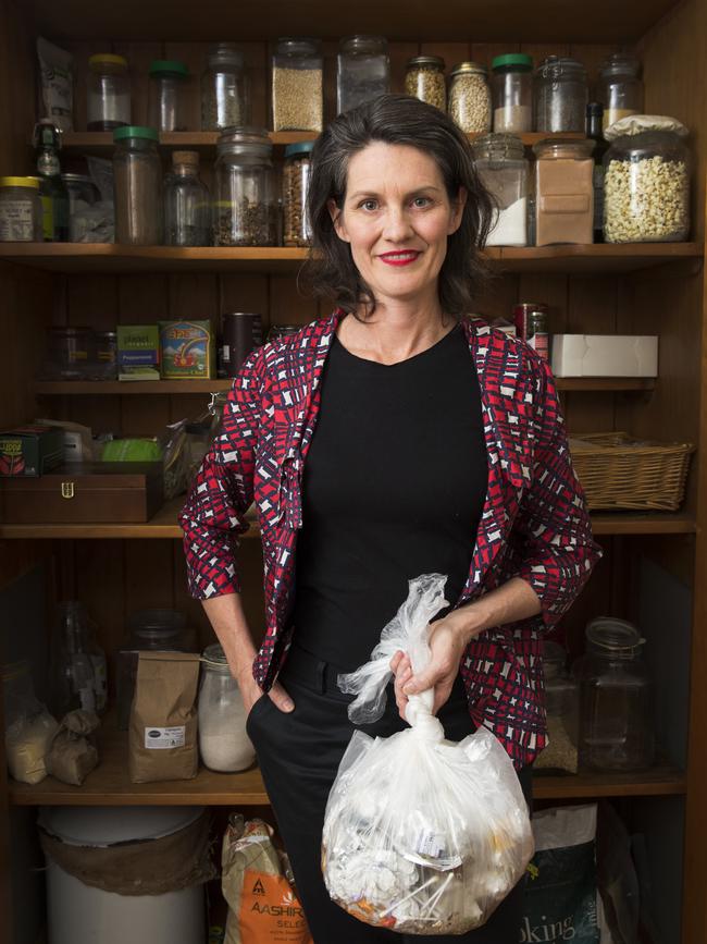 Emma-Kate Rose at home in her kitchen at Salisbury. Buying mainly in bulk foods and being savvy with compost and recycling they have managed to keep their waste just one small rubbish bag per week. Picture: Lachie Millard