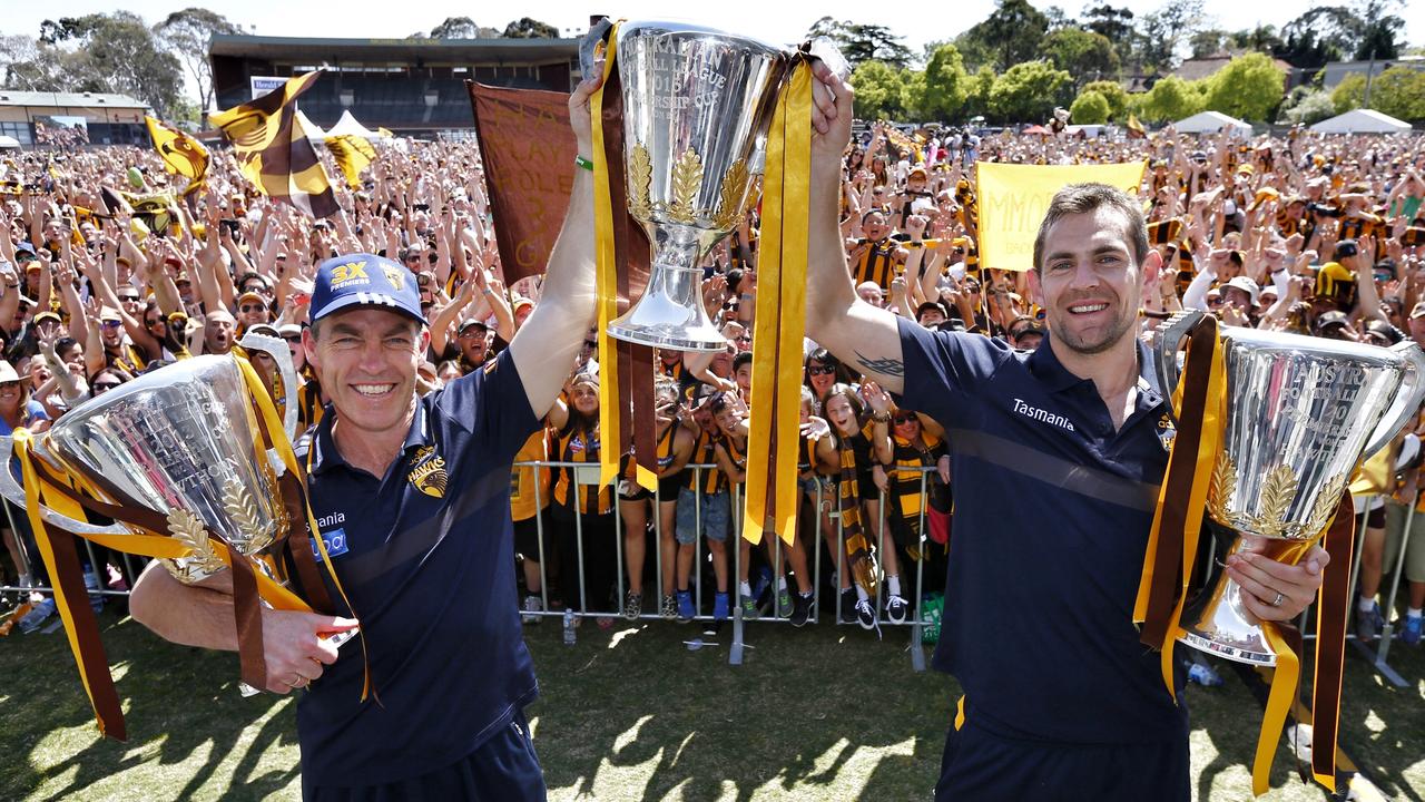 Hawthorn captain Luke Hodge and coach Alistair Clarkson hold the last three premiership cups. Picture: Michael Klein
