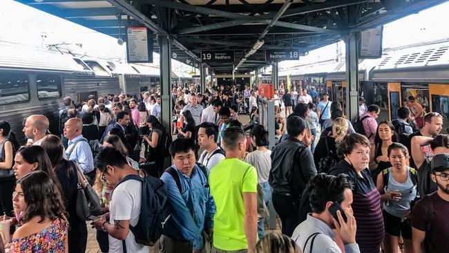 Commuters clamour to catch a train at Central Station. Picture: Nicholas Eagar