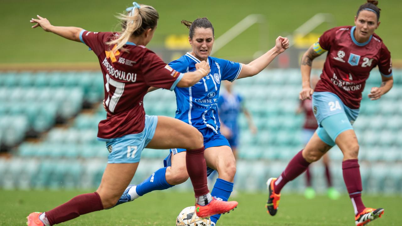 Angelique Hristodoulou attempting to win the ball from Olympic player Maxine Peak. Picture: Julian Andrews