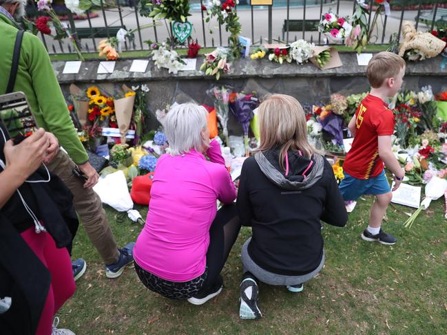  Hundreds of floral tributes run the length of a wall at the Botanic Gardens in Christchurch. Picture Gary Ramage