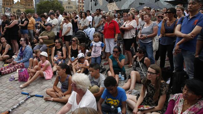 The public grieves for the Bourke St victims. Picture: David Caird