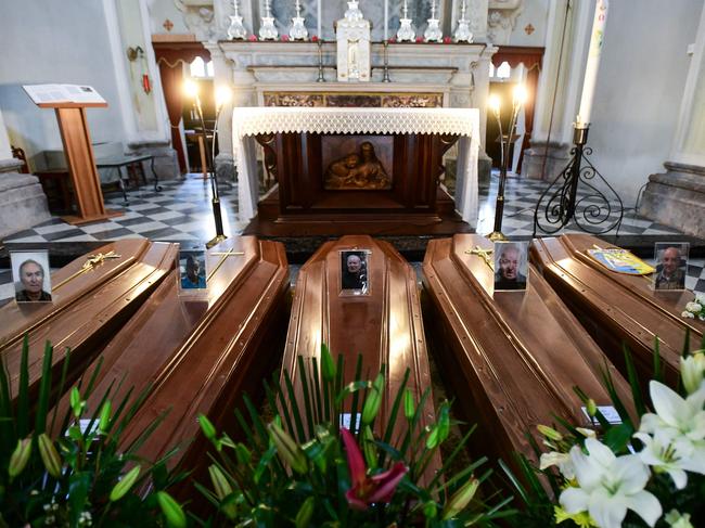 Coffins on the ground of the church in Serina, near Bergamo, northern Italy during a one-day record that saw the country's toll rise dramatically. Picture: AFP