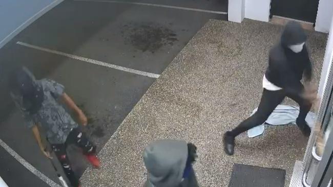 They broke through the doors with baseball bats before setting the business alight, police allege. Picture: Queensland Police Service