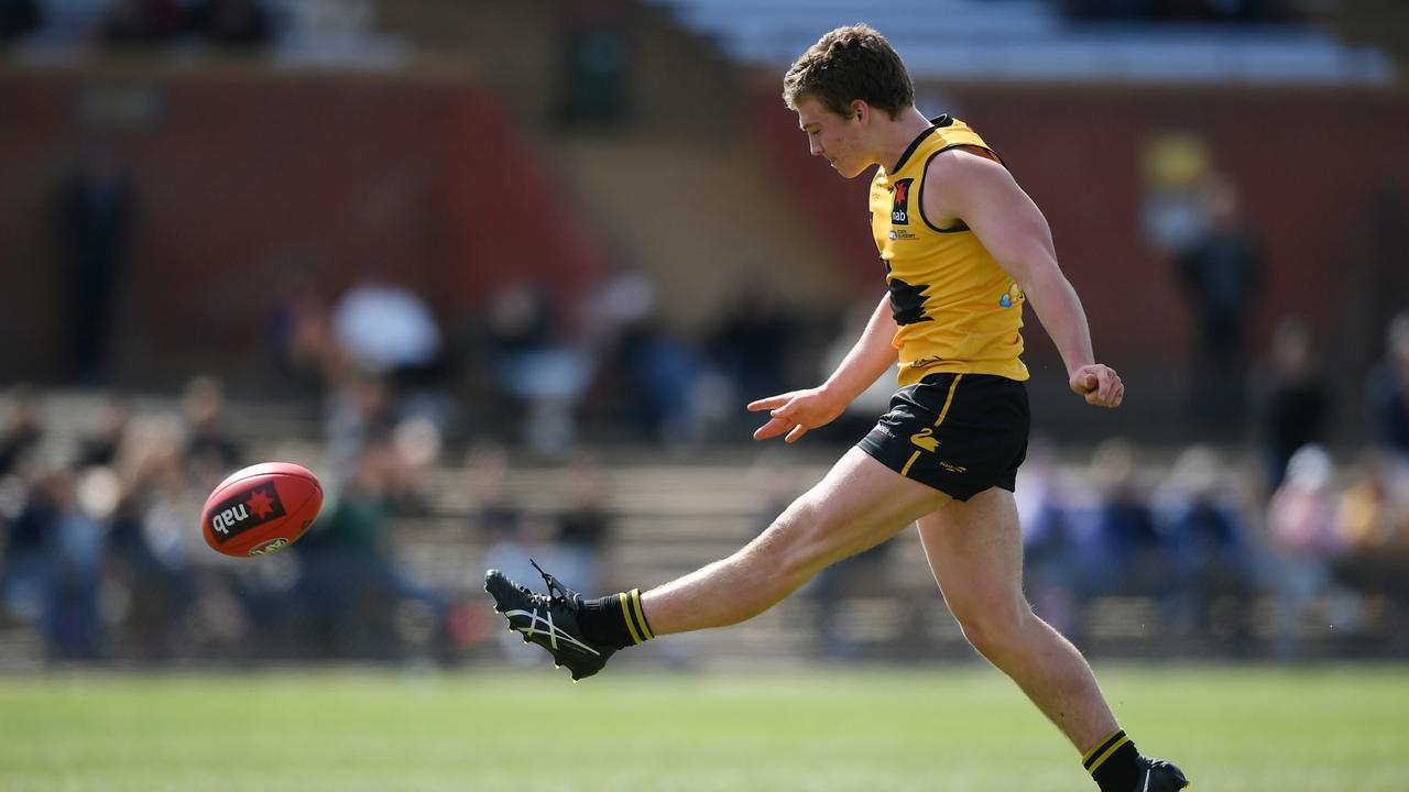 Angus Sheldrick kicking the sealing goal for Western Australia on Sunday. Picture: Mark Brake/AFL Photos/via Getty Images