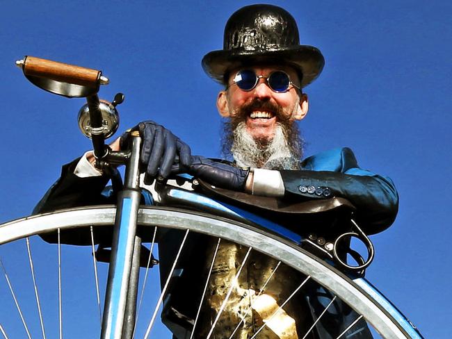 FOR WEEKEND ONLY....Weekend Eccentrics feature - Richard Nylon, milliner delivers his hand made hats by bike. MUST CREDIT ...Richard rides a hand built Penny Farthing by Dan Bolwell. Picture: Tim Carrafa