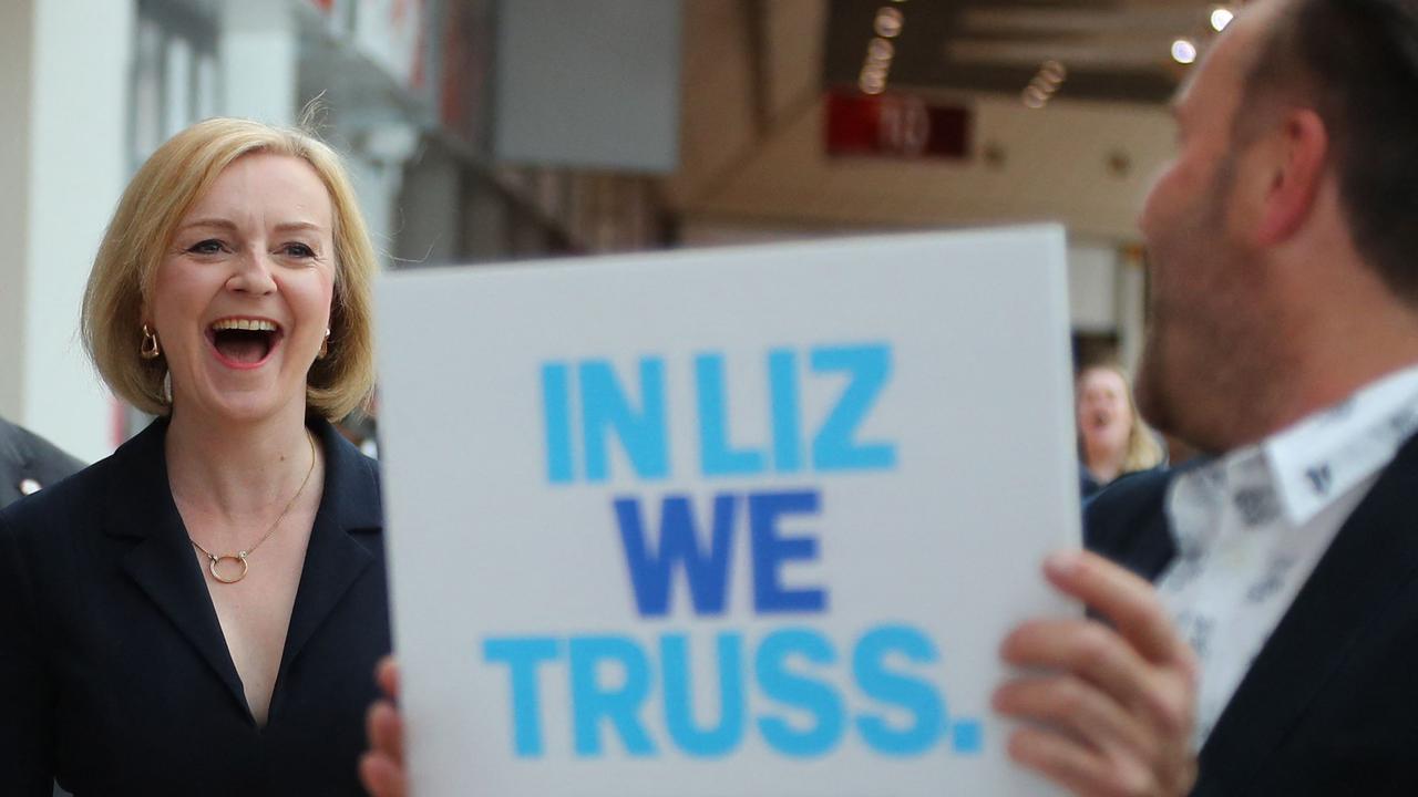 Liz Truss reacts as she is greeted by supporters upon her arrival to attend a Conservative Party Hustings event in Birmingham. (Photo by Geoff Caddick / AFP)