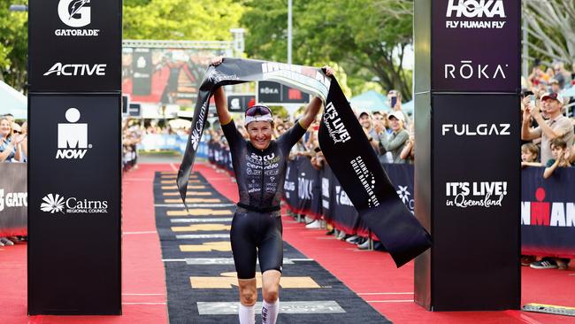 Kylie Simpson crosses the finish line on the Cairns Esplanade to win the Ironman Cairns Asia Pacific Championship race. Picture: Brendan Radke