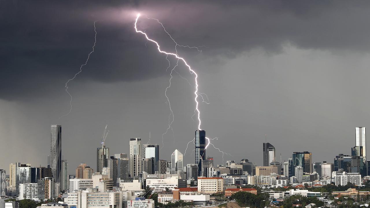 A storm pictured passing over Brisbane CBD. Picture: Josh Woning