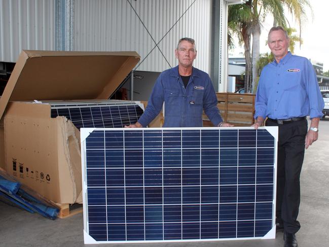 Keith Dobinson and his brother Glen unveil the first of 2000 solar panels to be installed over the coming month to help the Rockhampton business get off the grid.Photo Amber Hooker / CQ News