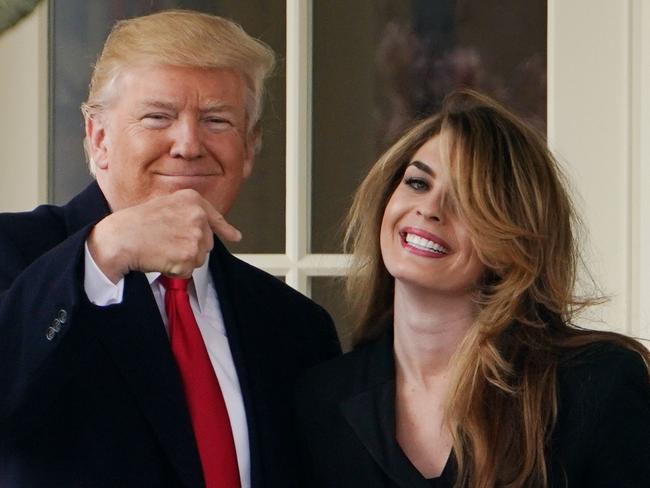 In this file photo taken on March 29, 2018 US President Donald Trump points to former communications director Hope Hicks shortly before making his way to board Marine One on the South Lawn and departing from the White House. Picture: AFP