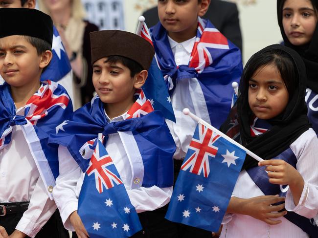 SYDNEY, AUSTRALIA- NewsWire Photos: JANUARY 26, 2025.The Ahmadiyya Muslim Community of Sydney set a new record by raising the largest Australian flag at Australia's largest mosque on Australia Day. The flag measures 16m x 8m, which is larger than the flag flying at the top of the Australian Parliament House.Children sing at the ceremony at the Baitul Huda Mosque Picture: NewsWire / Brendan Read