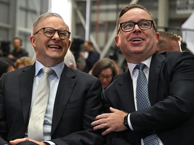 (lt-rt) Adam Goodes, Prime Minister Anthony Albanese and QANTAS CEO Alan Joyce as QANTAS unveil their Yes23 livery being carried on some of their aircraft at Sydney Domestic Airport in Sydney, Monday, August 14, 2023. (AAP Image/Dean Lewins) NO ARCHIVING