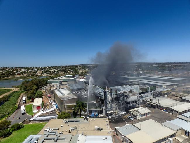Emergency services continue to fight the fire burning at the Thomas Foods abattoir in Murray Bridge. Picture: AAP / Roy Vandervegt
