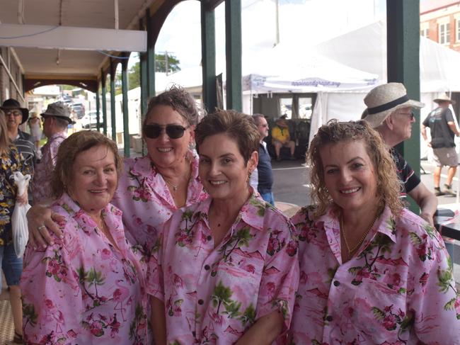 This group from Brisbane are still smiling after getting sticky at the Apple and Grape Festival grape crush, 1 March, 2024