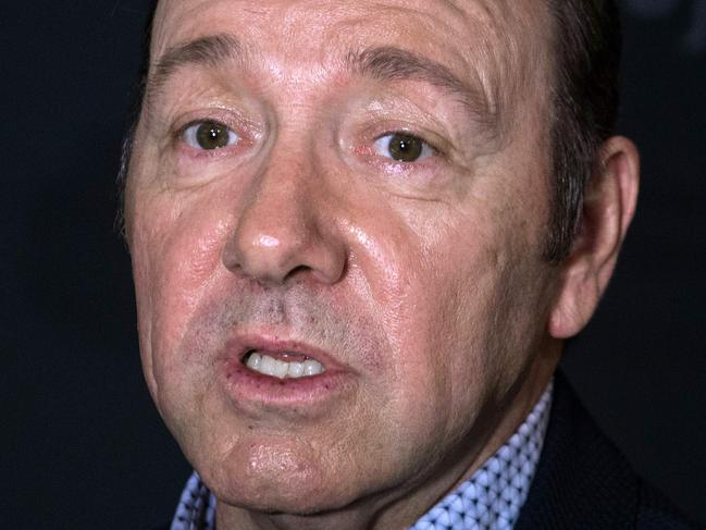 (FILES): This file photo taken on February 23, 2016 shows actor Kevin Spacey arriving for  the season 4 premiere screening of the Netflix show "House of Cards" in Washington, DC.  A man has accused Kevin Spacey of attempting to rape him when he was 15, amid mounting allegations of sexual harassment and assault against the "House of Cards" star.In an interview with the Vulture website, the man, who spoke on condition of anonymity, said he took part in an acting class taught by Spacey when he was 12. Two years later, they began what the man described in the interview as a "sexual relationship."    / AFP PHOTO / Nicholas Kamm