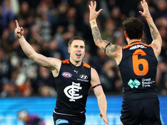 MELBOURNE, AUSTRALIA - JUNE 21: Matthew Owies of the Blues celebrates kicking a goal with Zac Williams of the Blues during the round 15 AFL match between Carlton Blues and Geelong Cats at Melbourne Cricket Ground, on June 21, 2024, in Melbourne, Australia. (Photo by Quinn Rooney/Getty Images)