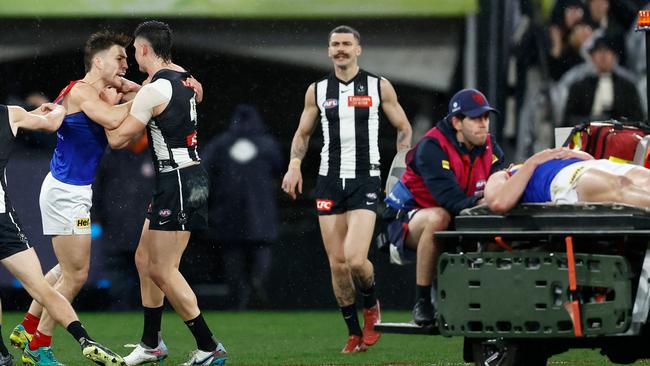 Brayden Maynard and Jack Viney clash as Angus Brayshaw leaves the field on a stretcher. (Photo by Michael Willson/AFL Photos via Getty Images)