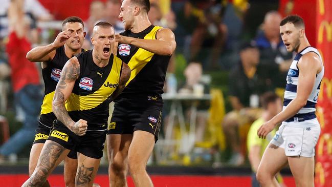 Dustin Martin celebrates his third goal with Jack Graham and Noah Balta. Picture: Michael Willson/AFL Photos